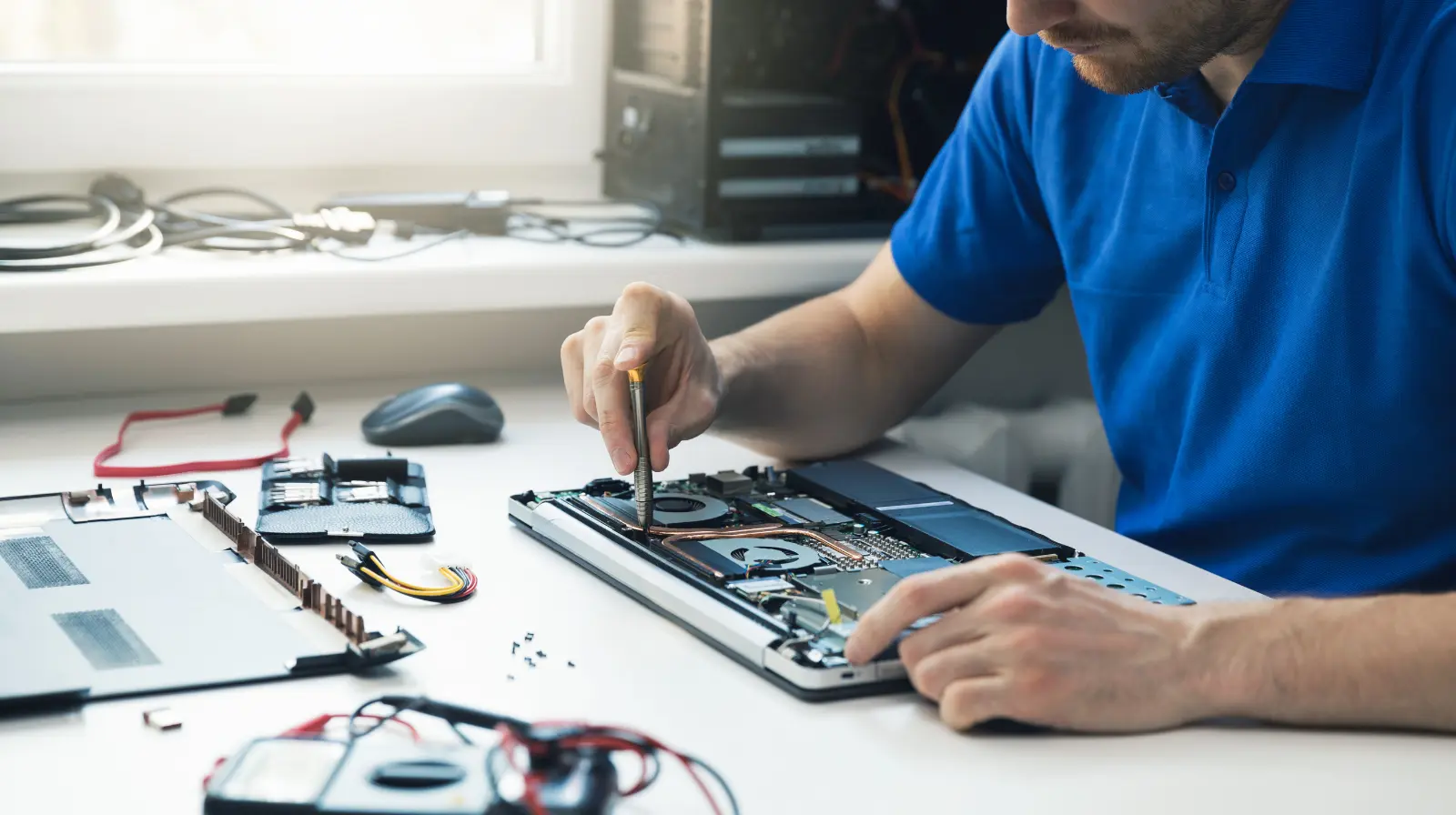 MacBook on a clean workbench during repair